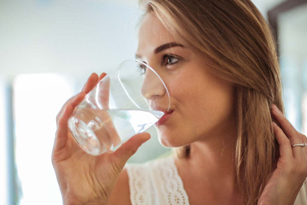 Woman drinking water from a glass